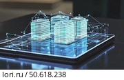 Digital rendering of several city buildings in glowing blue wireframe, projected from tablet with connected data lines. Smart architecture and network integration. Стоковое AI-видео, аниматор Елена Никишина / Фотобанк Лори
