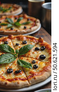 Authentic gourmet pizza selection served on restaurant table for sharing between friends during night out. Fresh ingredients and crispy crust on Italian traditional cuisine. Стоковое AI-видео, аниматор Sergey Grishin / Фотобанк Лори
