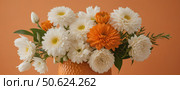 Bouquet of flowers in an orange vase on an orange background. Стоковое AI-изображение, AI-художник Анастасия / Фотобанк Лори