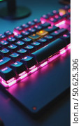 Close up of professional gaming keyboard with colorful LED backlight in multiple colors. Technology in gaming or developer industry. Desktop computer accessories. Стоковое AI-видео, аниматор Sergey Grishin / Фотобанк Лори
