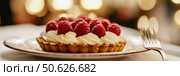Appetizing raspberry tart and mint. Raspberry danish cake on plate on table and coffee. Tartlets raspberry fruit with vanilla custard, whipped cream served in a cafe. Blurred bokeh interior background. Стоковое AI-изображение, AI-художник Марина Демидюк / Фотобанк Лори