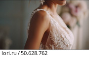 Elegant bridal gown showcase featuring intricate lace and floral details in a soft, romantic setting. Стоковое AI-видео, аниматор Сергей Толмачёв / Фотобанк Лори