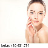 Beautiful young woman with clean fresh skin on face . Girl facial treatment . Cosmetology , beauty and spa . Стоковое фото, фотограф Sofia Zhuravetc / Фотобанк Лори