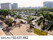 Large Parking Lot Crowded With Vehicles in Ho Chi Minh City, Vietnam (2024 год). Редакционное фото, фотограф Aleksandr Golubev / Фотобанк Лори