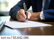 Businessman writing and signing business document at office desk. Стоковое AI-изображение, AI-художник Иван Рябоконь / Фотобанк Лори