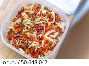 Dried vegetable mix for soups containing onions, carrots, peppers and other vegetables in a plastic container on a table. Стоковое фото, фотограф Татьяна Степанищева / Фотобанк Лори