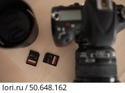 Camera with lens and flash drives. brown background. Стоковое фото, фотограф Роготнева Виктория / Фотобанк Лори
