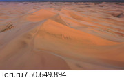 Aerial view of sand dunes in desert at sunset. Стоковое фото, фотограф Михаил Коханчиков / Фотобанк Лори