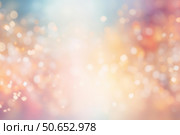 Abstract pastel background shining with golden festive bokeh lights and glittering particles. Стоковое AI-изображение, AI-художник Иван Рябоконь / Фотобанк Лори