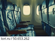 Empty seats on an airplane suggesting low occupancy flight. Стоковое AI-изображение, AI-художник Иван Рябоконь / Фотобанк Лори