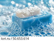 White soap with foam lathering on blue soap bar surrounded by water drops. Стоковое AI-изображение, AI-художник Иван Рябоконь / Фотобанк Лори