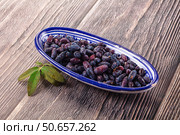 Sweet juicy ripe honeysuckle berries. Стоковое фото, фотограф Андрей Старостин / Фотобанк Лори