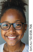 Headshot portrait of happy mixed race black african girl wearing glasses. Стоковое AI-видео, аниматор Sergey Grishin / Фотобанк Лори
