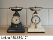 Two vintage scales showing empty trays in kitchen setting. Стоковое AI-изображение, AI-художник Иван Рябоконь / Фотобанк Лори
