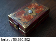 Ornate vintage jewelry box with intricate design. Стоковое AI-изображение, AI-художник Иван Рябоконь / Фотобанк Лори