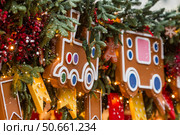 Beautiful Christmas background. Beautiful holiday toys on the New Year's tree in Moscow. Concept of preparation and decoration for the new year 2026. Стоковое фото, фотограф Photojuli / Фотобанк Лори