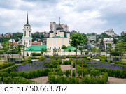 Voronezh, Russia, May 31, 2025: Assumption Admiralty Cathedral in summer in beautiful flower beds. Редакционное фото, фотограф Катерина Белякина / Фотобанк Лори