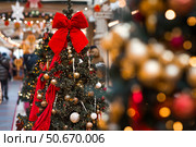 Beautiful Christmas background. Holiday toys on the Christmas tree. Concept of preparing decorations and furnishings for the New Year. New Year's card 2026. Стоковое фото, фотограф Photojuli / Фотобанк Лори
