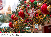 Magical Christmas background. Concept of preparation and decoration for the New Year. Holiday toys on the New Year's tree in Moscow. New Year's card 2026. Стоковое фото, фотограф Photojuli / Фотобанк Лори