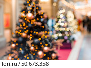 Beautiful Christmas background 2026.Abstract blurred Christmas background with Christmas tree garlands in warm shades. Стоковое фото, фотограф Photojuli / Фотобанк Лори