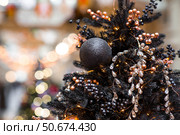 Beautiful Christmas background. Beautiful holiday toys on the New Year's tree in Moscow. Concept of preparation and decoration for the new year 2026. Стоковое фото, фотограф Photojuli / Фотобанк Лори