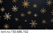 compositi gold snowflakes on black ai generated. Стоковое AI-изображение, AI-художник Vectorwin / Фотобанк Лори