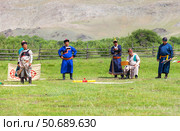 ELANTSY VILLAGE, IRKUTSK REGION, RUSSIA - July 5, 2025: Erdyn Games are festival of nomadic peoples of Eurasia. Group of judges in national costumes set up red target for archery competition. Редакционное фото, фотограф Виктория Катьянова / Фотобанк Лори