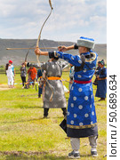 ELANTSY VILLAGE, IRKUTSK REGION, RUSSIA - July 5, 2025: Erdyn Games - festival of ethnic nomadic peoples of Eurasia, archery competitions in national costumes at sacred Erd mountain on Baikal Lake. Редакционное фото, фотограф Виктория Катьянова / Фотобанк Лори