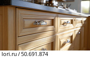 sleek kitchen cabinet handles. Стоковое фото, фотограф Vectorwin / Фотобанк Лори