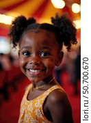 African American child's wonder and happiness at circus show with colorful dome tent background marking World Circus Day. Inclusive entertainment concept. Стоковое AI-изображение, AI-художник Светлана Леуто / Фотобанк Лори