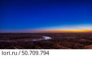 Panorama of Orion and the winter stars in the twilight sky over the Bow River valley, Alberta, Canada. Стоковое фото, фотограф Alan Dyer/Stocktrek Images / ТАСС / Фотобанк Лори