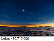 The total eclipse of the Sun over the waters of Lac-Brome, Quebec, Canada. Стоковое фото, фотограф Alan Dyer/Stocktrek Images / ТАСС / Фотобанк Лори