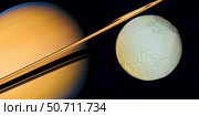 Artist's concept of Saturn and it's moon Tethys. Стоковое фото, фотограф Corey Ford/Stocktrek Images / ТАСС / Фотобанк Лори
