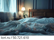 Unmade bed in a cozy bedroom with soft morning light entering through window. Стоковое AI-изображение, AI-художник Иван Рябоконь / Фотобанк Лори
