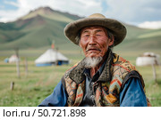 Mongolian shepherd wearing traditional clothes and hat posing in front of yurts. Стоковое AI-изображение, AI-художник Иван Рябоконь / Фотобанк Лори