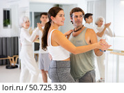 Men and women dancing in pairs during training session. Стоковое фото, фотограф Яков Филимонов / Фотобанк Лори
