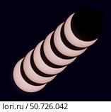 The October 14, 2023 annular solar eclipse showing the moon advancing across a sunspot. Стоковое фото, фотограф Alan Dyer/Stocktrek Images / ТАСС / Фотобанк Лори