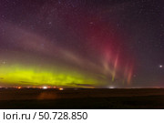 A Kp4-level aurora borealis with a STEVE arc, Alberta, Canada. Стоковое фото, фотограф Alan Dyer/Stocktrek Images / ТАСС / Фотобанк Лори