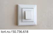 Modern light switch on a textured wall in a well-lit room. Стоковое AI-изображение, AI-художник Katsiaryna Repich / Фотобанк Лори