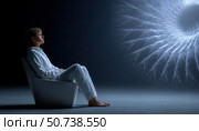 Patient observing hypnotic fractal during therapy session. Стоковое AI-изображение, AI-художник Юрий Поздников / Фотобанк Лори