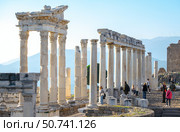 1 January 2023 Bergama, Turkey -The Temple of Trajan in Pergamon  with tourists in a sunny day. Редакционное фото, фотограф Алена Аксенова / Фотобанк Лори