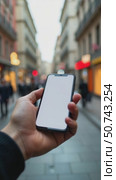 A Hand is Presented With a Smartphone in a Lively City Street, Bustling With Pedestrians and Colorful Storefronts. Стоковое AI-видео, аниматор Sergey Grishin / Фотобанк Лори