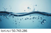 Water Creates Dynamic Ripples and Bubbles Against a Bright Blue Background, Producing a Calm and Refreshing Underwater Ambiance. Стоковое AI-видео, аниматор Sergey Grishin / Фотобанк Лори