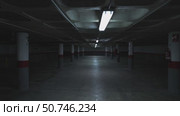 Neon lights flickering in empty parking garage. Стоковое видео, видеограф Данил Руденко / Фотобанк Лори
