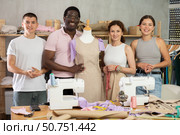 Positive attendees of dressmaking courses standing by mannequin. Стоковое фото, фотограф Яков Филимонов / Фотобанк Лори