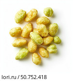 Crunchy wasabi peas scattered on white background, creating appealing snack display. Стоковое AI-изображение, AI-художник Иван Рябоконь / Фотобанк Лори