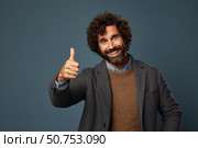Happy businessman showing thumbs up sign approving and agreeing. Стоковое AI-изображение, AI-художник Иван Рябоконь / Фотобанк Лори
