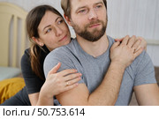 Mature couple hugging hugging each other kissing at home bedroom. Intimate Moment. Tender embrace shared between a loving middle age man and woman, husband and wife. Deep love. Low key, cinematic. Стоковое фото, фотограф Марина Демидюк / Фотобанк Лори