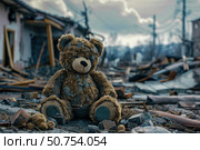 Abandoned teddy bear sitting amidst war torn city ruins symbolizing loss and devastation. Стоковое AI-изображение, AI-художник Иван Рябоконь / Фотобанк Лори
