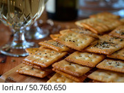 Savory crackers with black pepper and wine pairing. Стоковое AI-изображение, AI-художник Иван Рябоконь / Фотобанк Лори